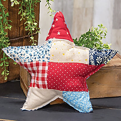 Patchwork Americana star pillow with rustic red white and blue farmhouse fabric patterns