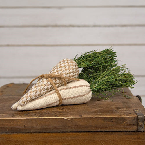 Linen-style checkered and striped pattern on bundled fabric carrots