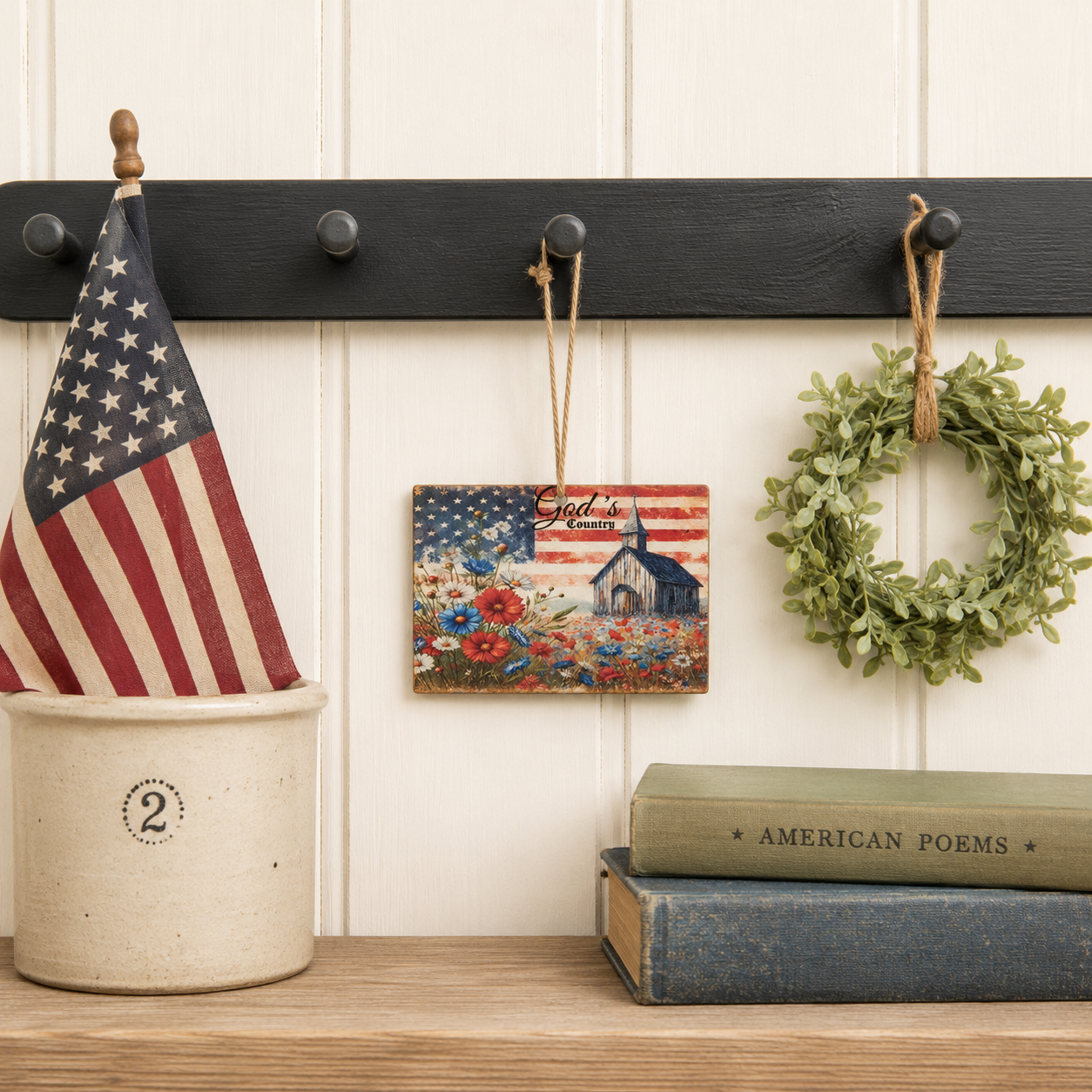 Rustic Americana hanging ornament with weathered barn artwork patriotic floral field and jute twine hanger
