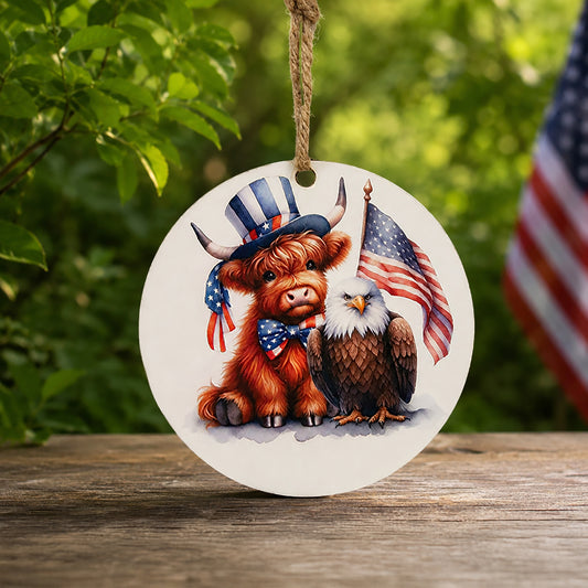 Baby Highland cow and bald eagle patriotic wooden ornament with waving American flag and jute hanger