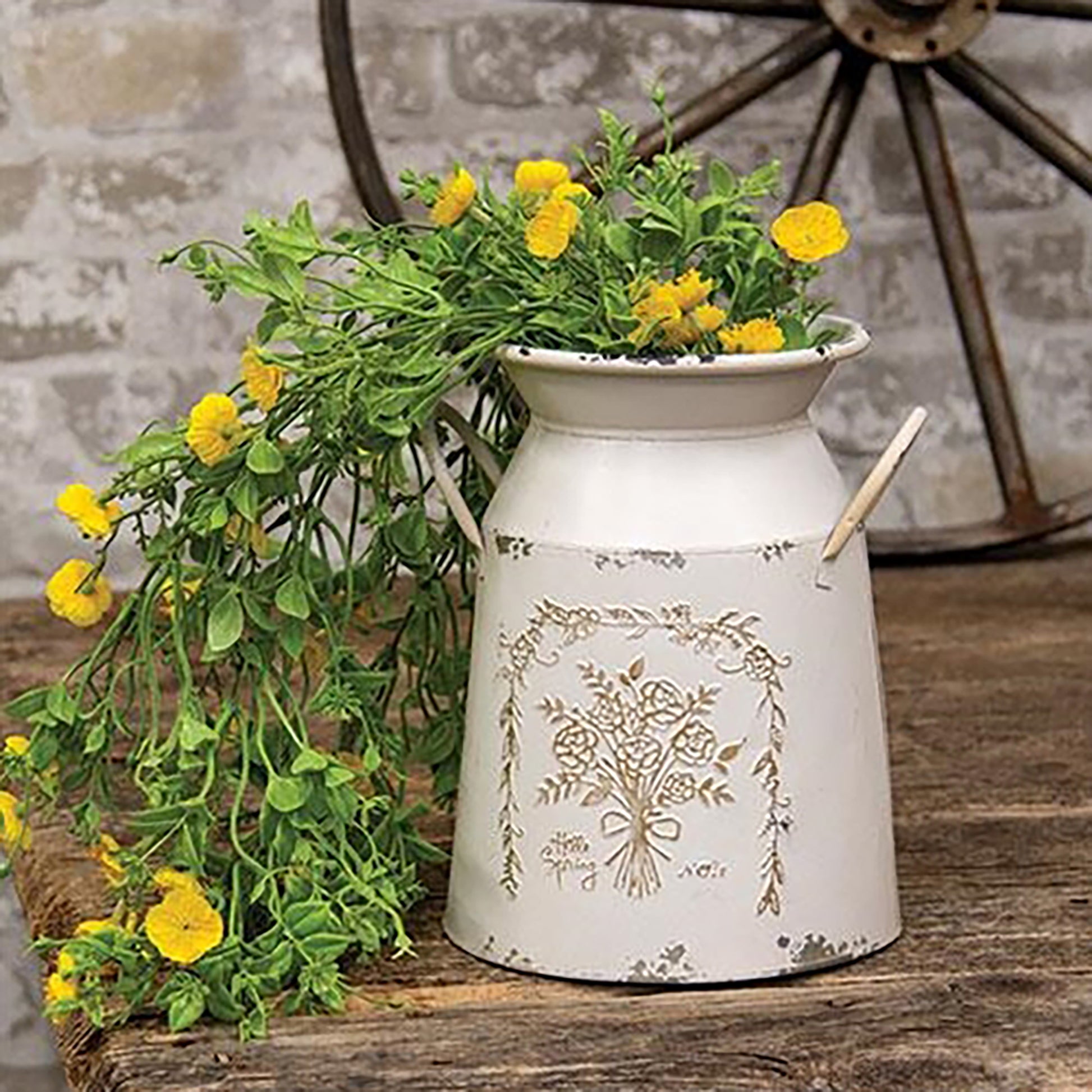 Embossed spring flower detailing on white metal decorative milk can with handles