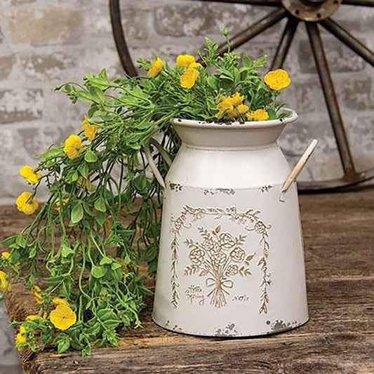 Embossed spring flower detailing on white metal decorative milk can with handles