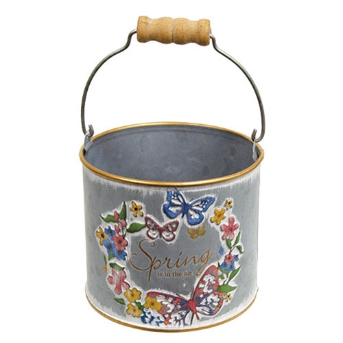Embossed "Spring is in the Air" butterfly design on rustic metal bucket