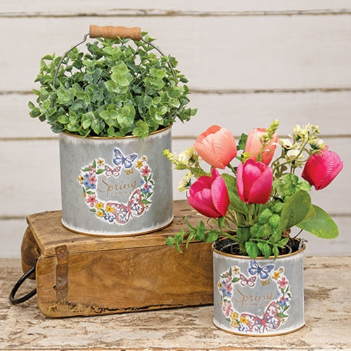 Wooden handle on small galvanized bucket with gold rim