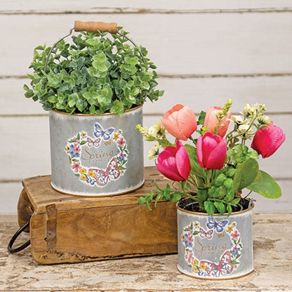 Wooden handle on small galvanized bucket with gold rim