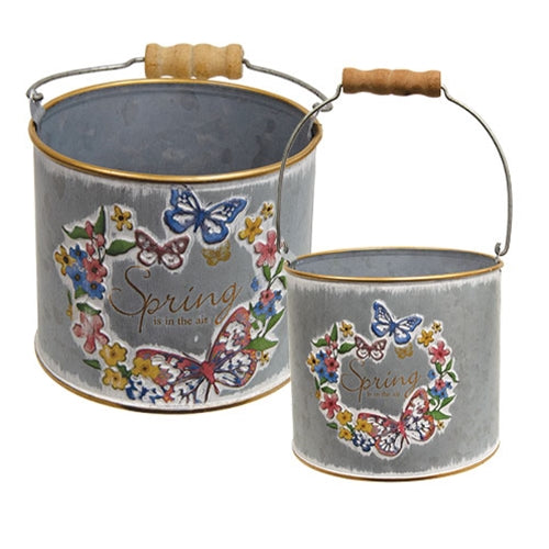 Set of two galvanized metal spring buckets with embossed butterflies and flowers