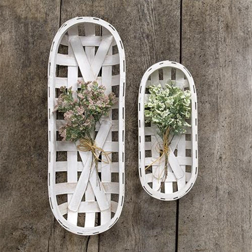 Two whitewashed oval tobacco baskets with rustic wood weave, styled against a white backdrop.