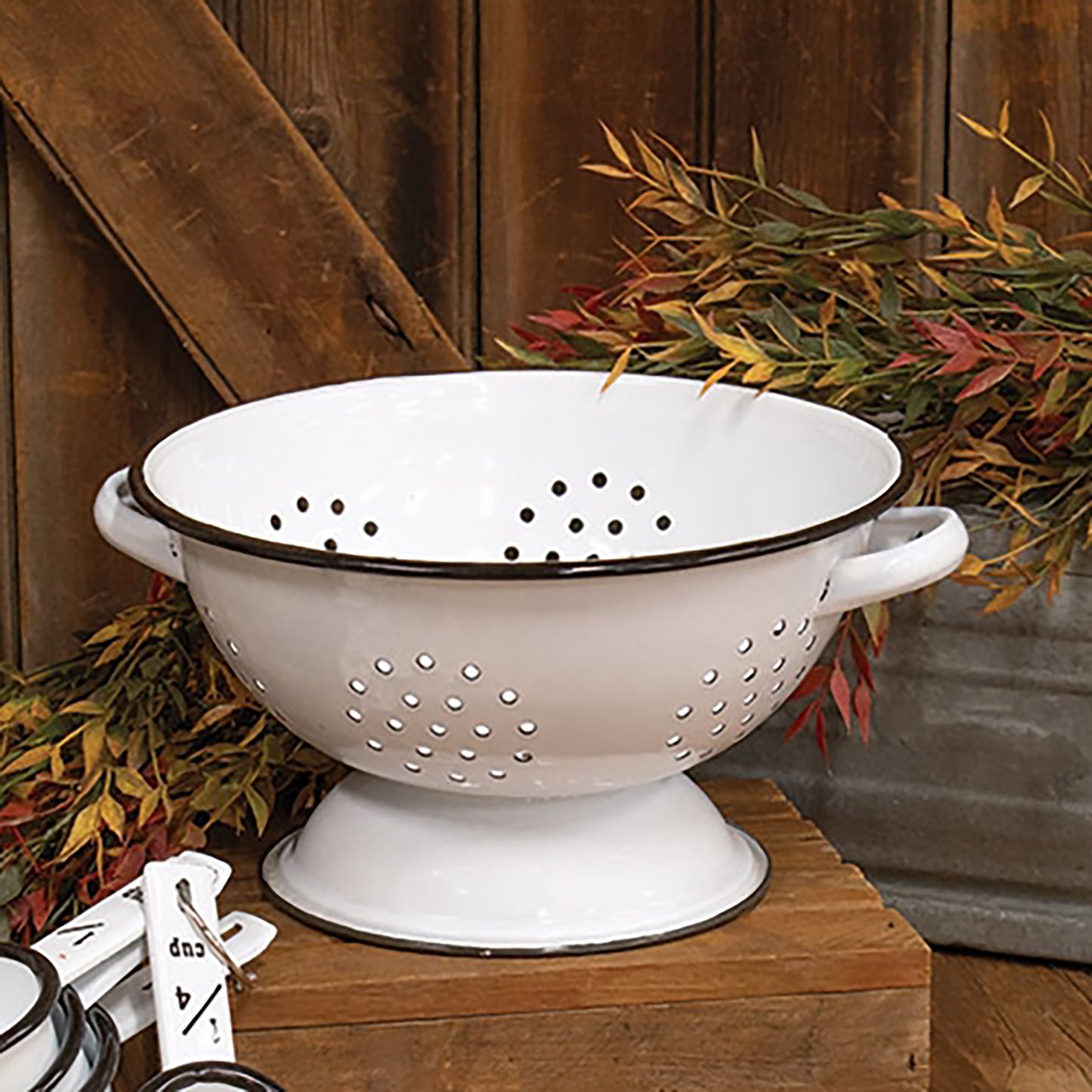 Enamelware colander with distressed white finish and black edging for rustic farmhouse décor