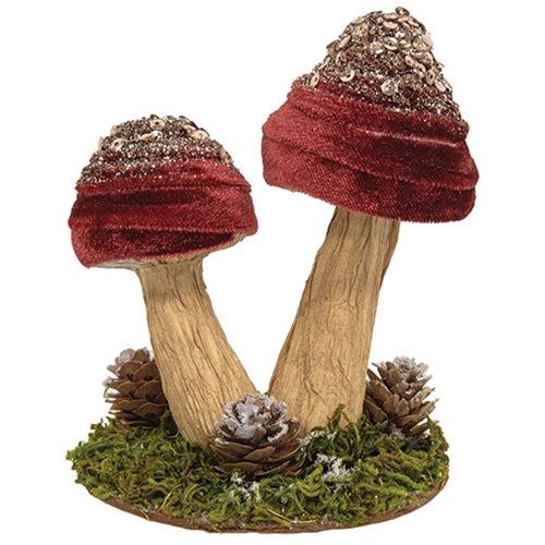Rustic seasonal mushroom figurine with soft velvet texture and moss base