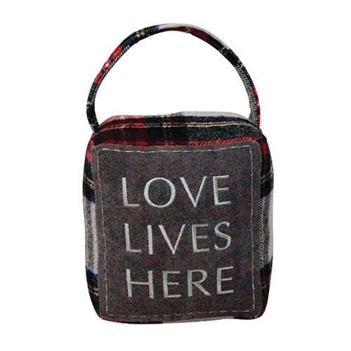 Plaid flannel weighted doorstop with embroidered “love lives here” patch and handle