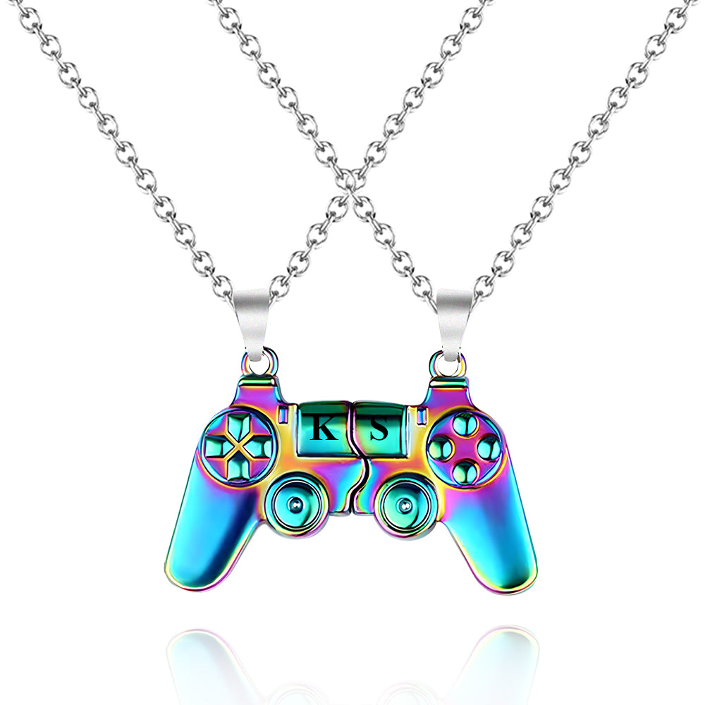 Side-by-side view of a magnetic gamer necklace set, featuring two alloy controller charms that connect seamlessly.