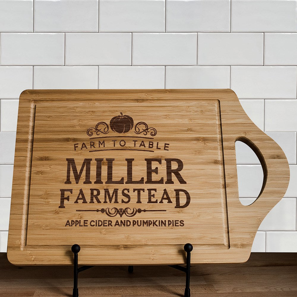 Personalized engraved bamboo cutting board with farmhouse design and family name