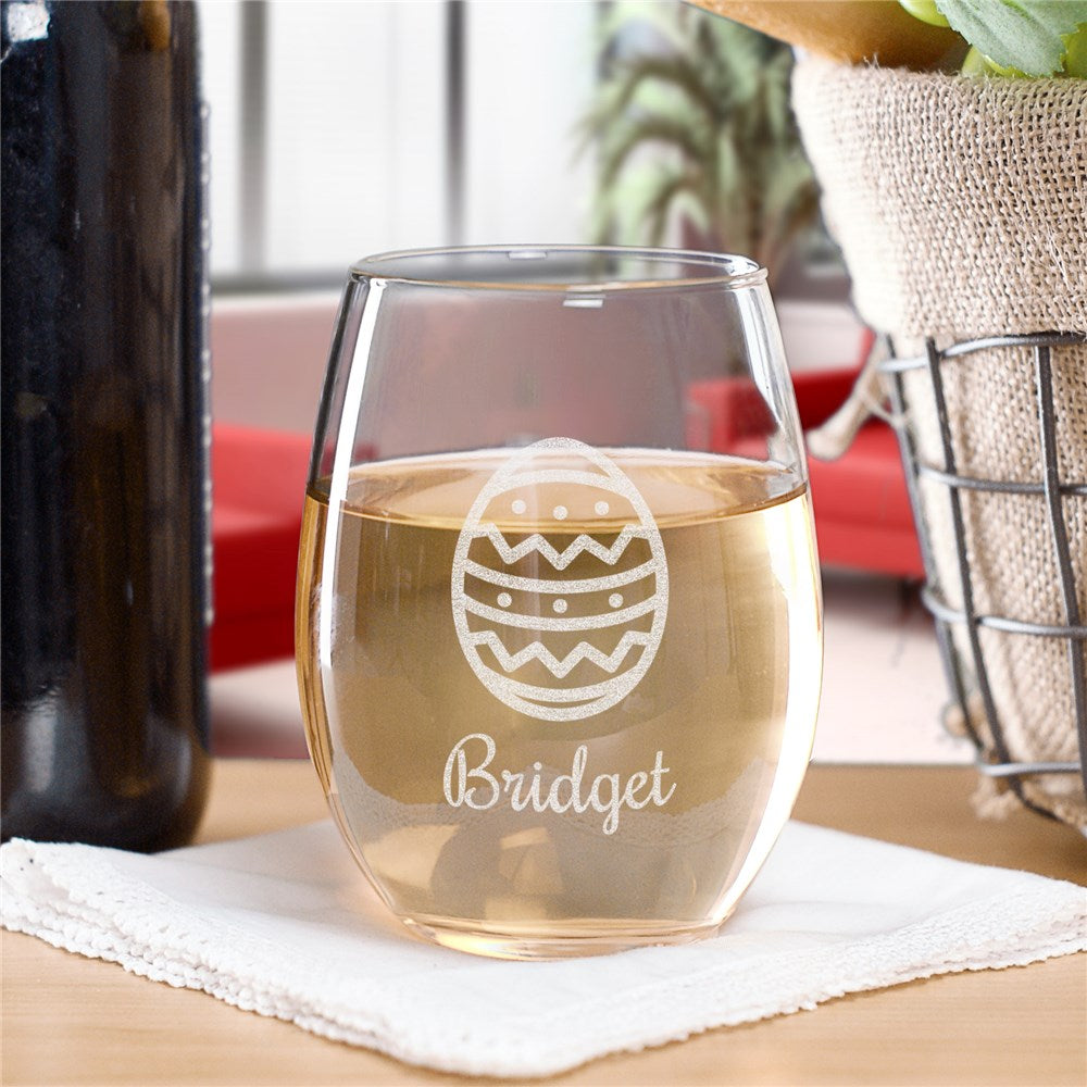 A 17 oz stemless wine glass engraved with an Easter egg and a custom name, ideal for spring celebrations and Easter brunch.
