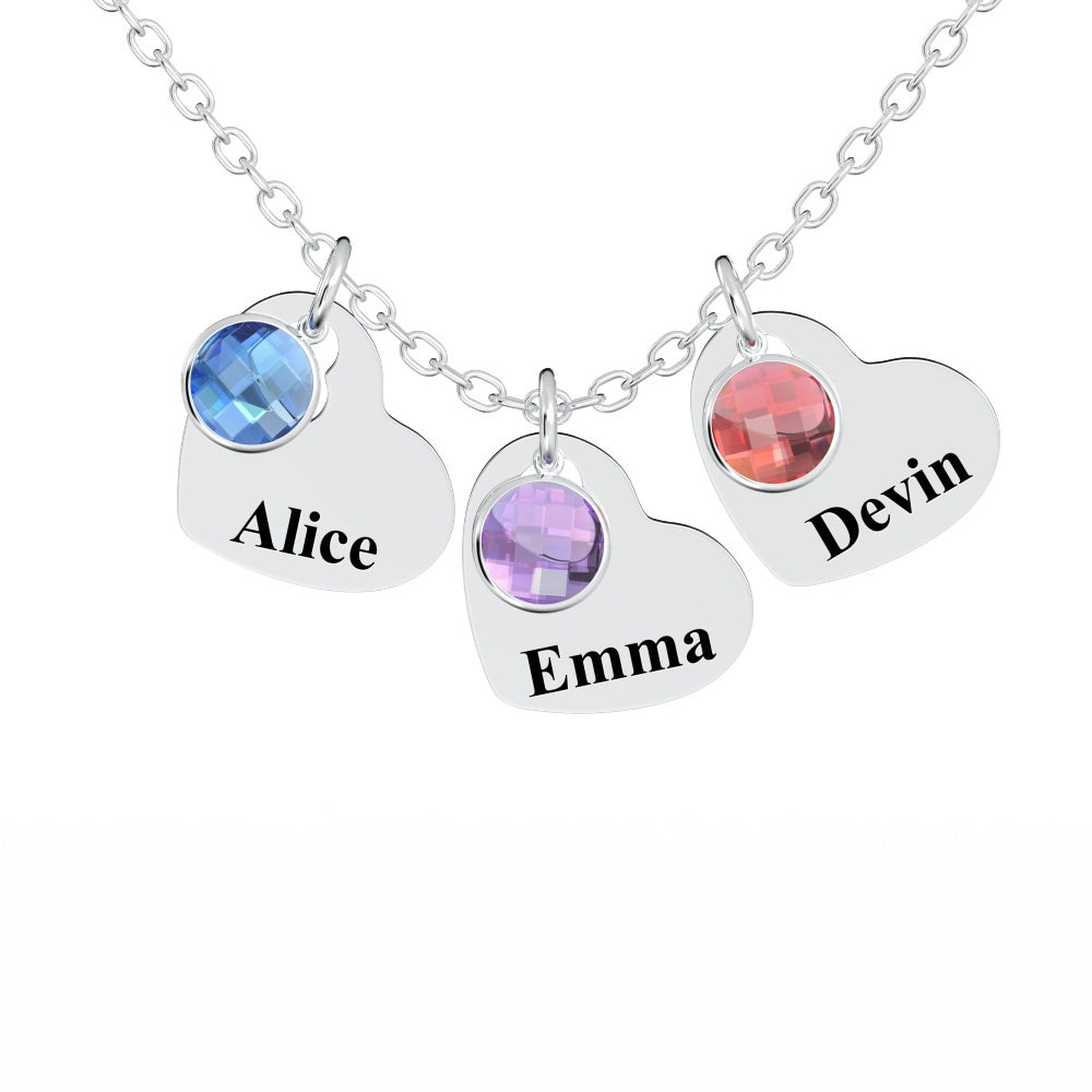 A silver necklace with three birthstone charms, each engraved with a name.