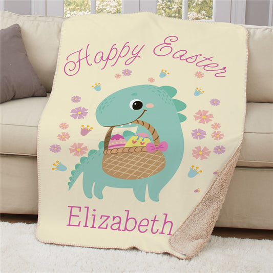 Personalized kids Easter blanket featuring a playful dinosaur holding a colorful Easter basket, customized with child's name, soft mink front with tan Sherpa backing for warmth and comfort.