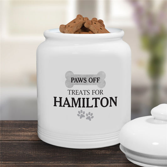 Ceramic dog treat jar with watercolor bone and "Paws Off" design personalized with pet's name