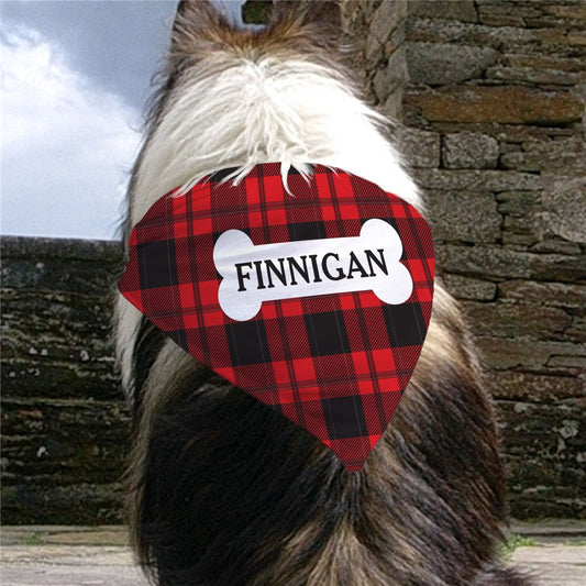 Personalized red plaid dog bandana with white bone graphic and custom name in all caps
