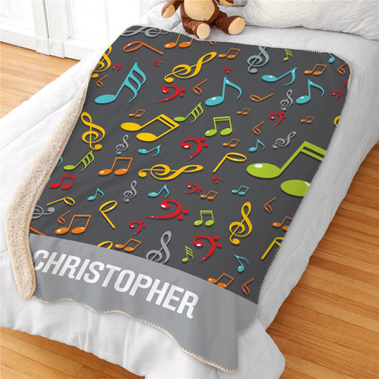 Personalized Kids Sherpa Blanket with custom name engraving. Features a soft mink-touch front and plush tan Sherpa back. Warm, lightweight, and machine washable.