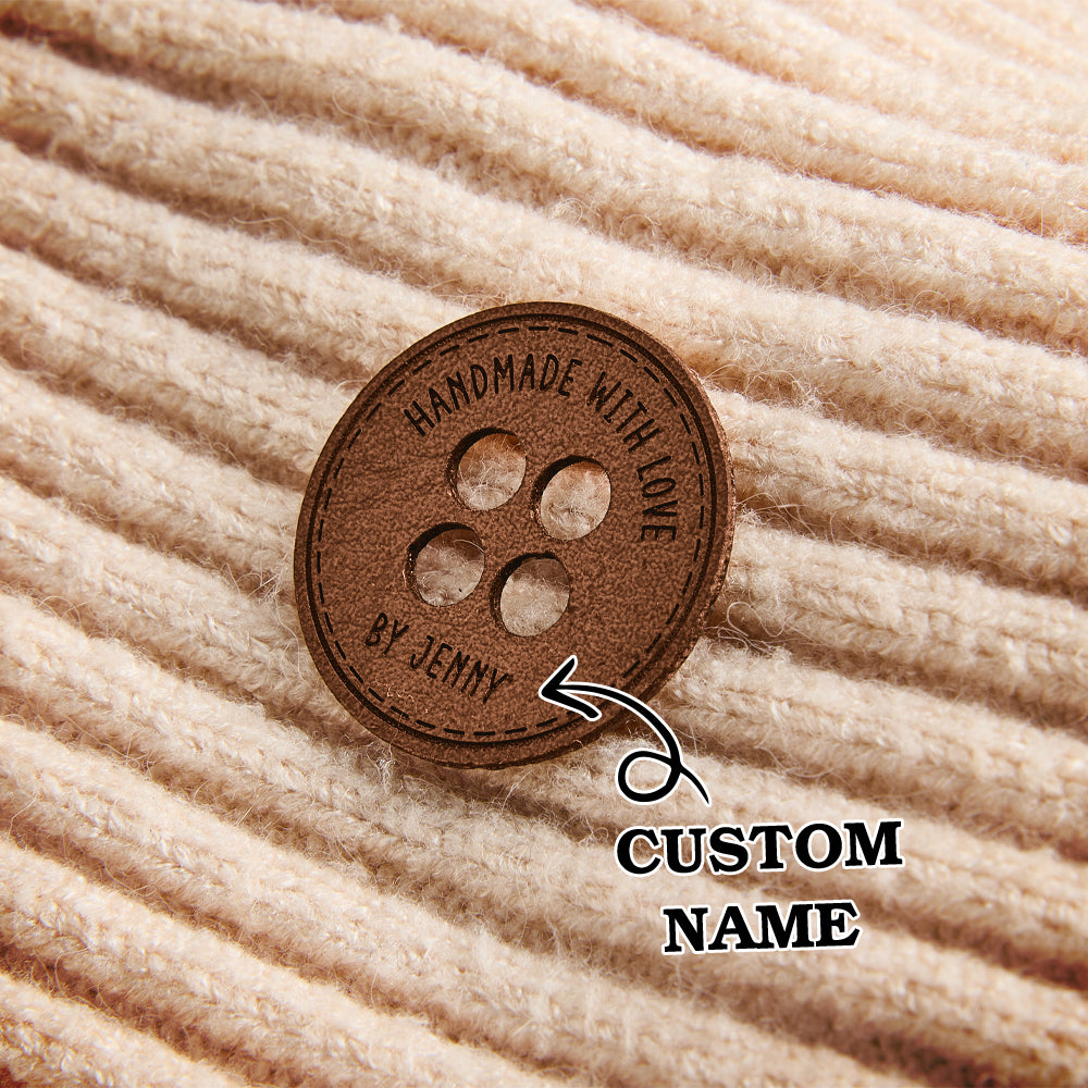 Engraved craft labels made from PU leather, customized for branding handmade products like knitted and crocheted items.