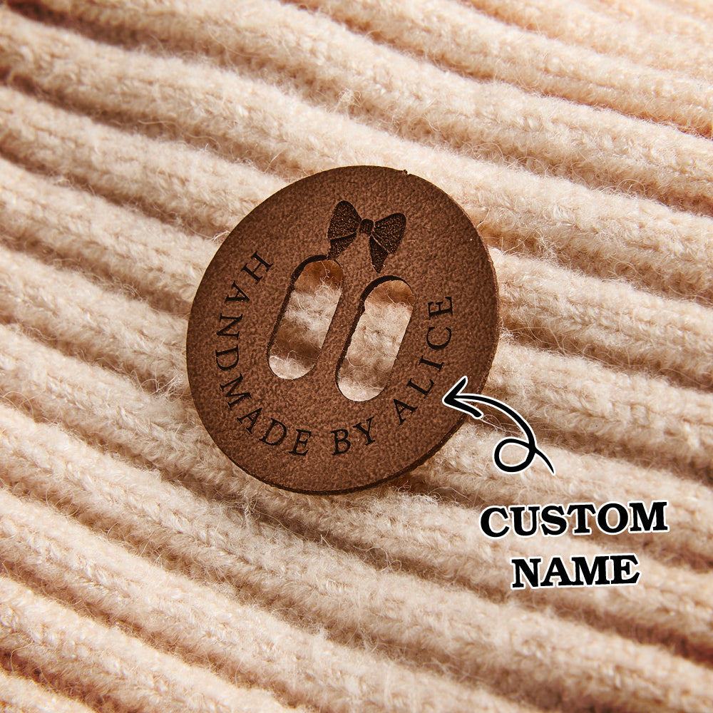 Custom name leather labels for handmade businesses. Perfect for branding knitted and crocheted items with engraved text.