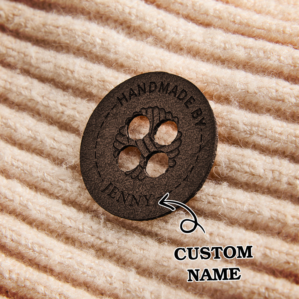 Custom product labels for knitters and crocheters. Engraved leather sewing tags for personalized branding on handmade items.