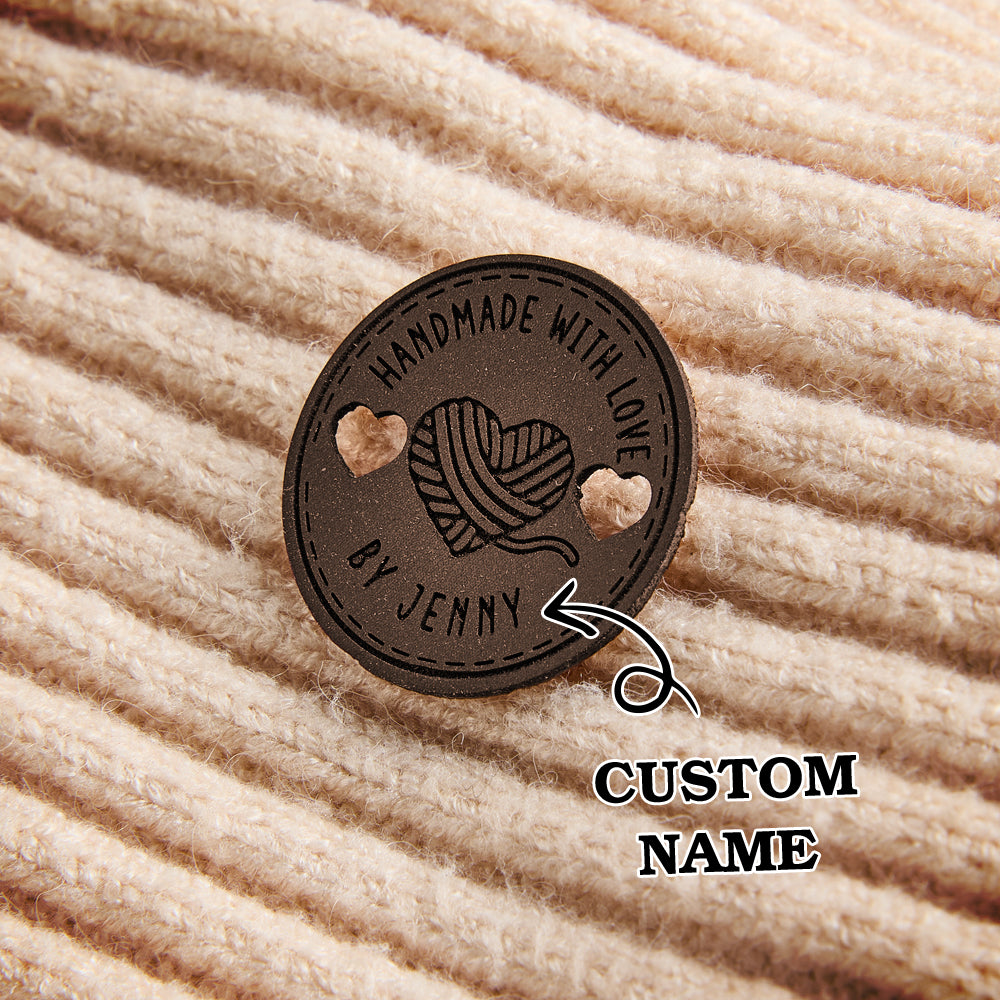 Custom engraved vegan leather tags for handmade crafts, perfect for knitters, crocheters, and sewing enthusiasts looking for personalized branding.