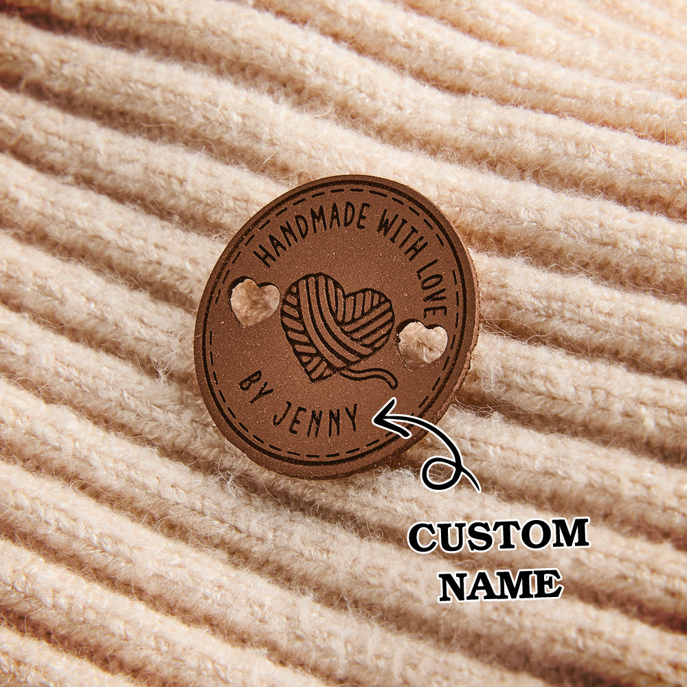 Handmade leatherette labels for artisan creators. Engraved name tags ideal for knitting, crochet, sewing, and handmade product branding.