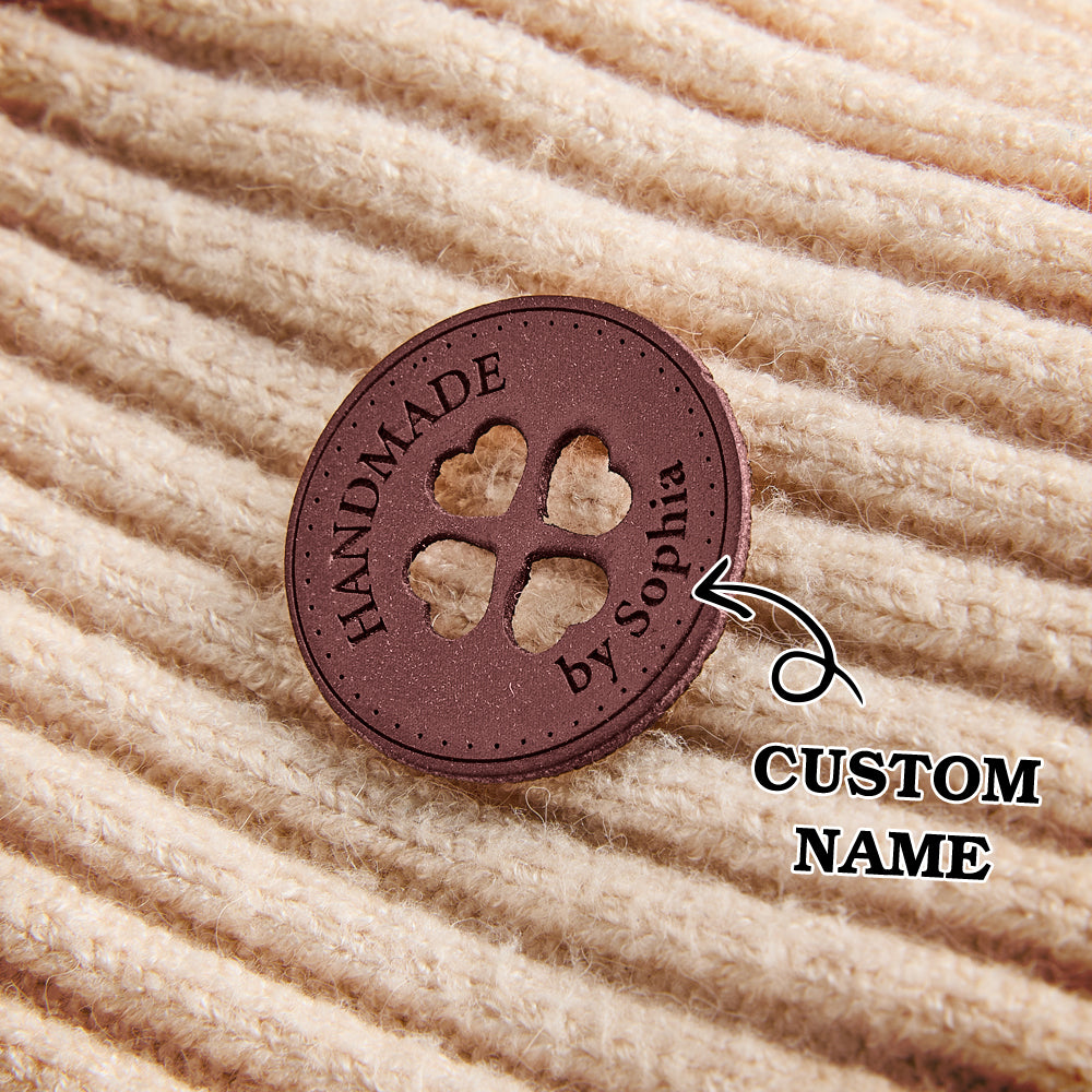 Handmade garment labels for crafters, knitters, and sewing artists. Custom synthetic leather tags for small business branding.