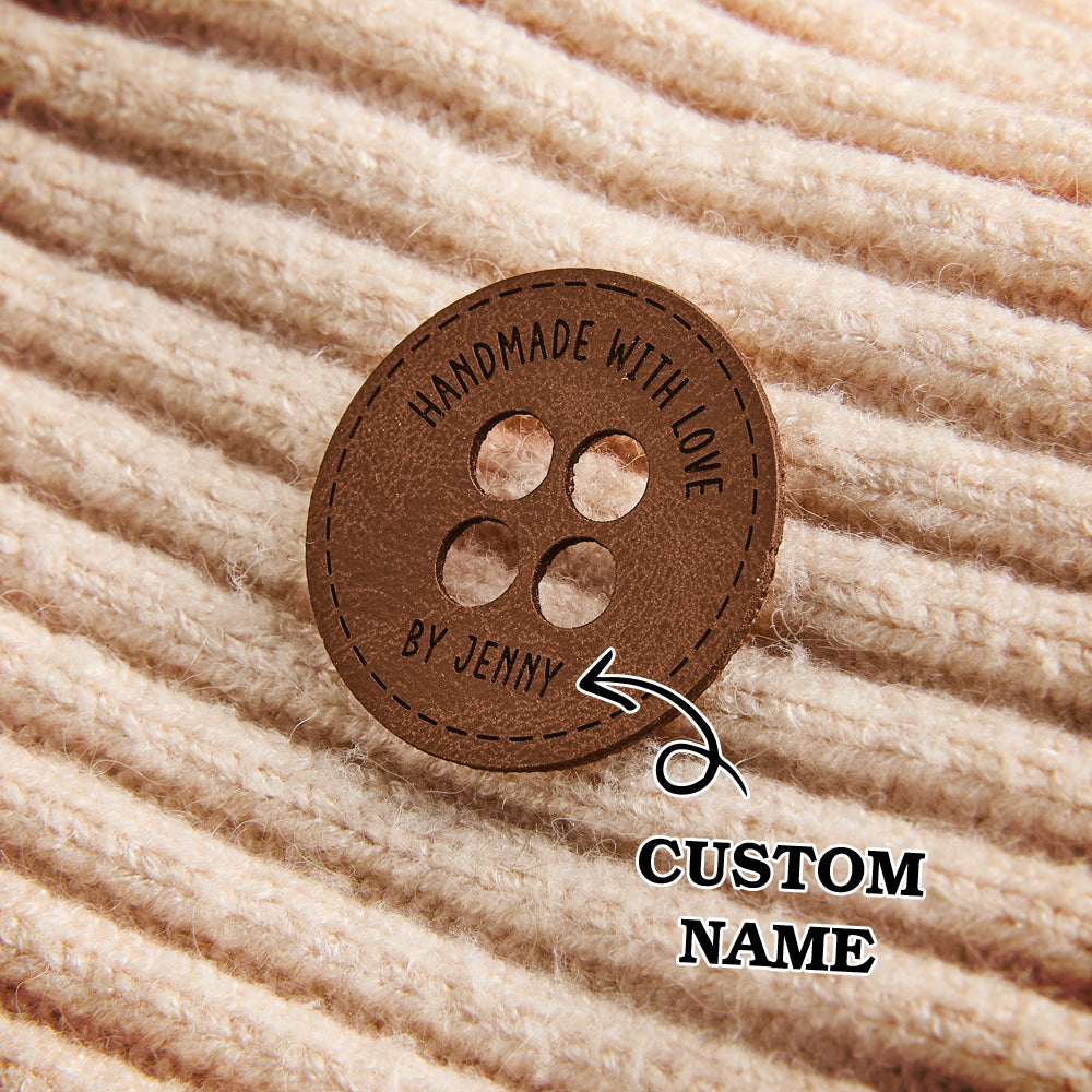 Custom faux leather product labels with engraved names for knitwear, crocheted blankets, and DIY sewing projects.