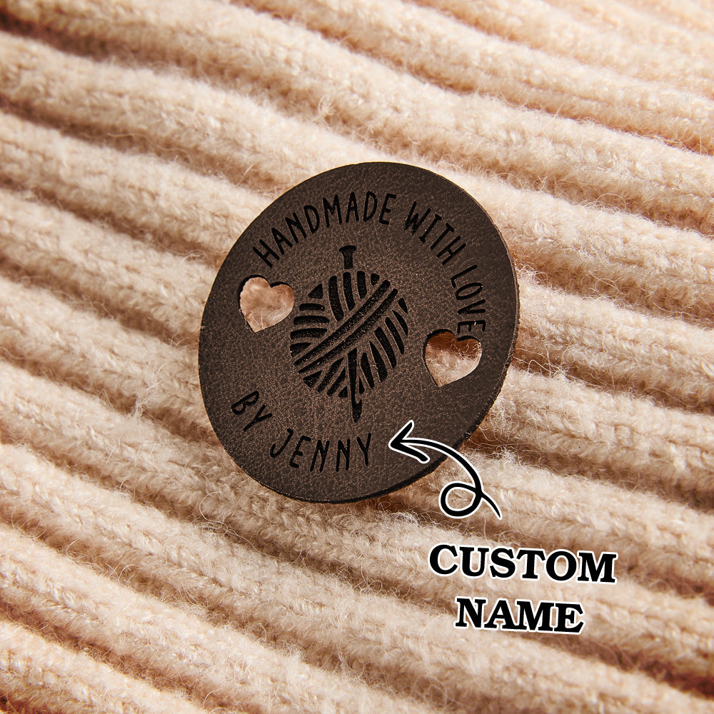 Custom engraved leatherette tags for handmade knitting, crochet, and sewing items. Ideal for personalized small business branding.