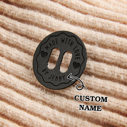 Handmade vegan leather name tags with engraved text. Perfect for branding crochet and knitwear accessories.