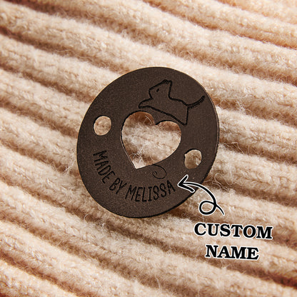 Custom synthetic leather name tags for sewing, quilting, and handmade fiber art products.