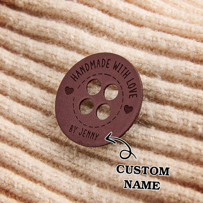 Engraved leather sewing labels for branding small business handmade products, including crochet and fiber arts.