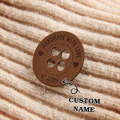 Engraved faux leather name tags for fiber artists, perfect for handmade crochet and knitting product branding.