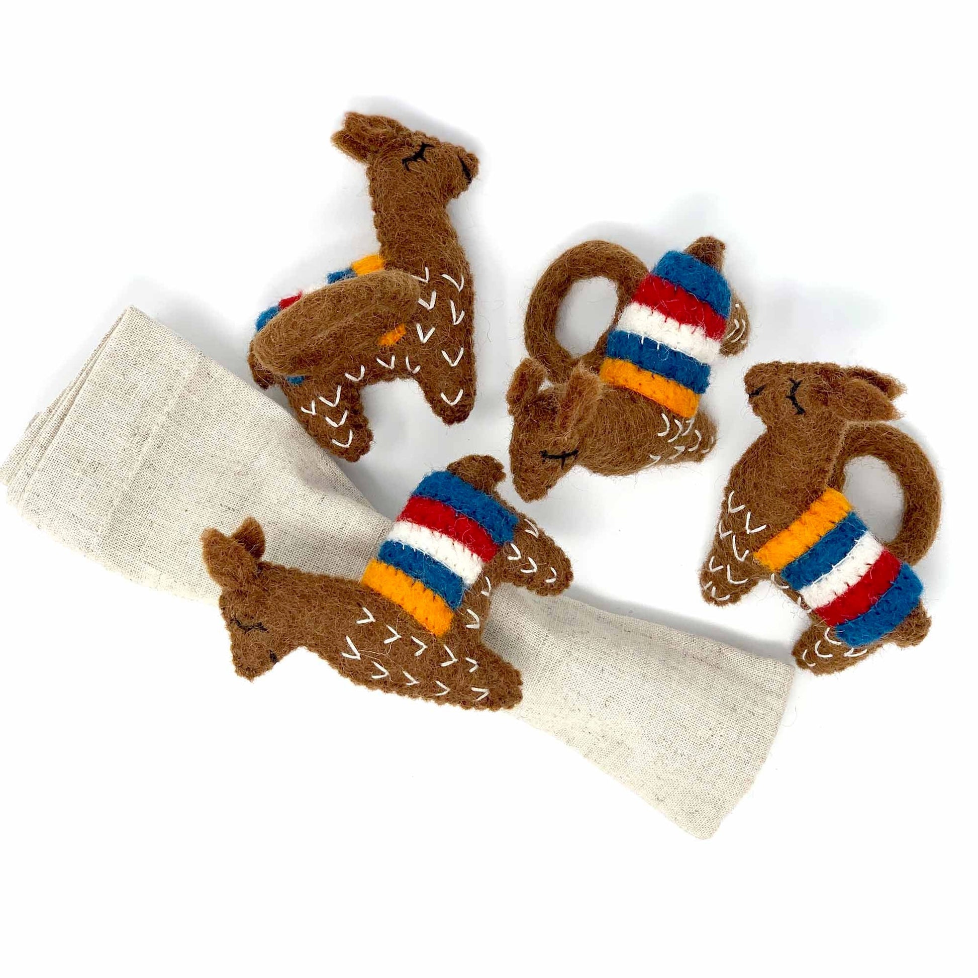 Set of four chocolate brown llama-shaped felt napkin rings handmade in Nepal, ethical wool decor for rustic or whimsical table settings