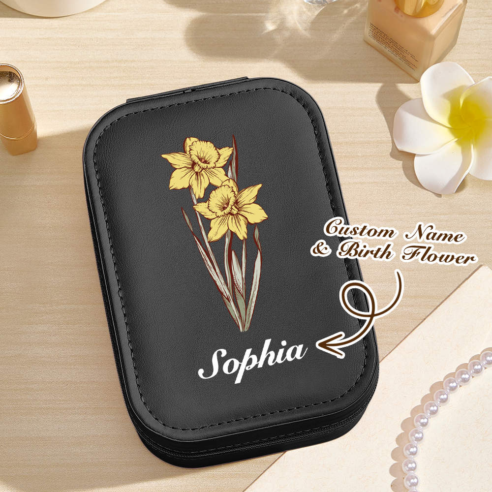 A top view of the black version of the personalized jewelry box, with text overlay indicating that the name and birth flower are customizable for a personal touch.