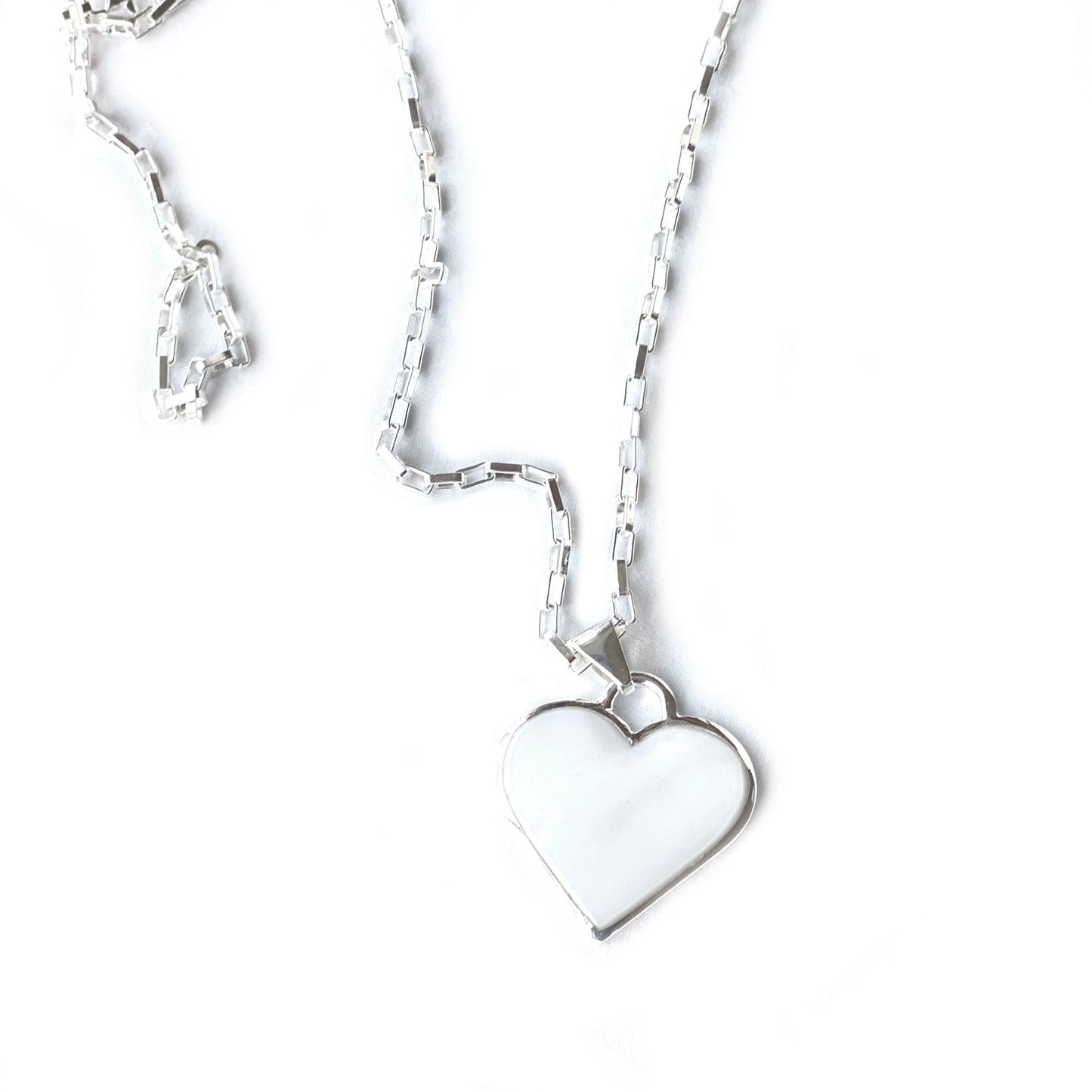 Corazón Blanco necklace laid flat to show detail and size