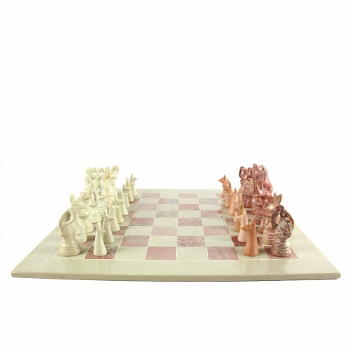 Fair Trade soapstone chess set with African animal-inspired pieces on a smooth, polished board.