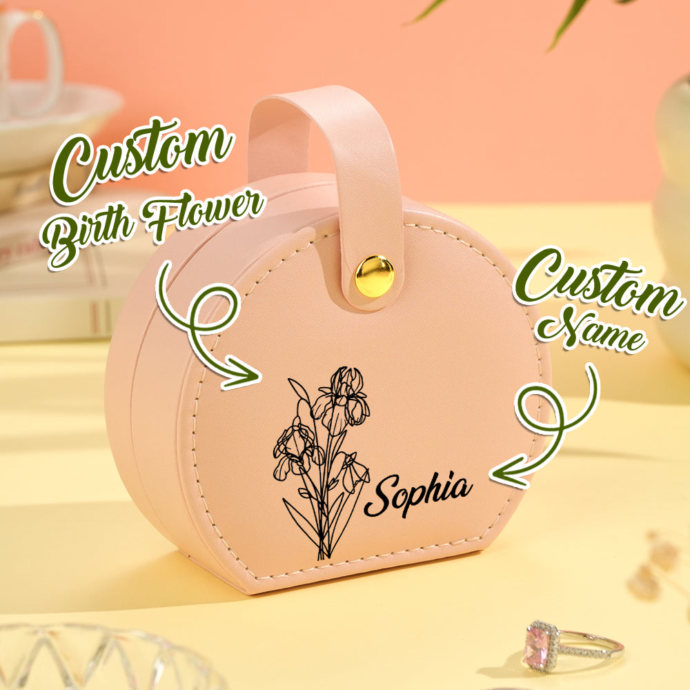 Close-up of a pink birth flower jewelry box, highlighting the customizable name and engraved floral design on the soft vegan leather exterior.