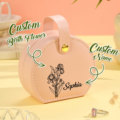 Close-up of a pink birth flower jewelry box, highlighting the customizable name and engraved floral design on the soft vegan leather exterior.