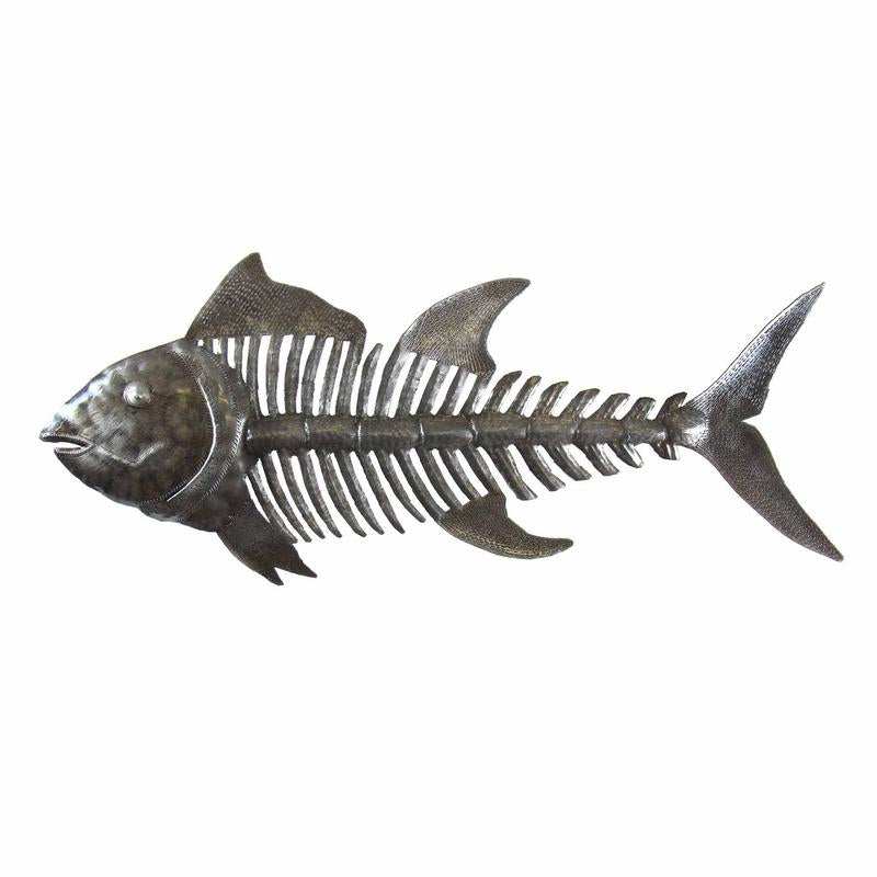 Handcrafted fish bones wall art made from recycled steel oil drums in Haiti, featuring natural metallic finish and hammered texture.