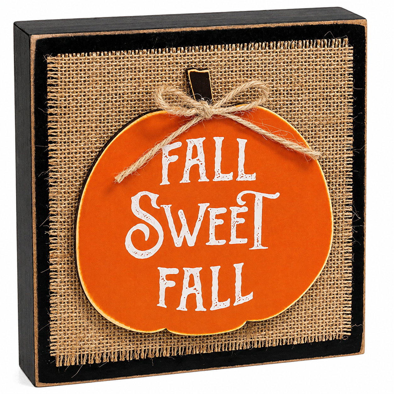 Square black-framed decorative sign with a burlap-textured center and an orange pumpkin-shaped insert that reads “FALL SWEET FALL” in white lettering, tied with twine.
