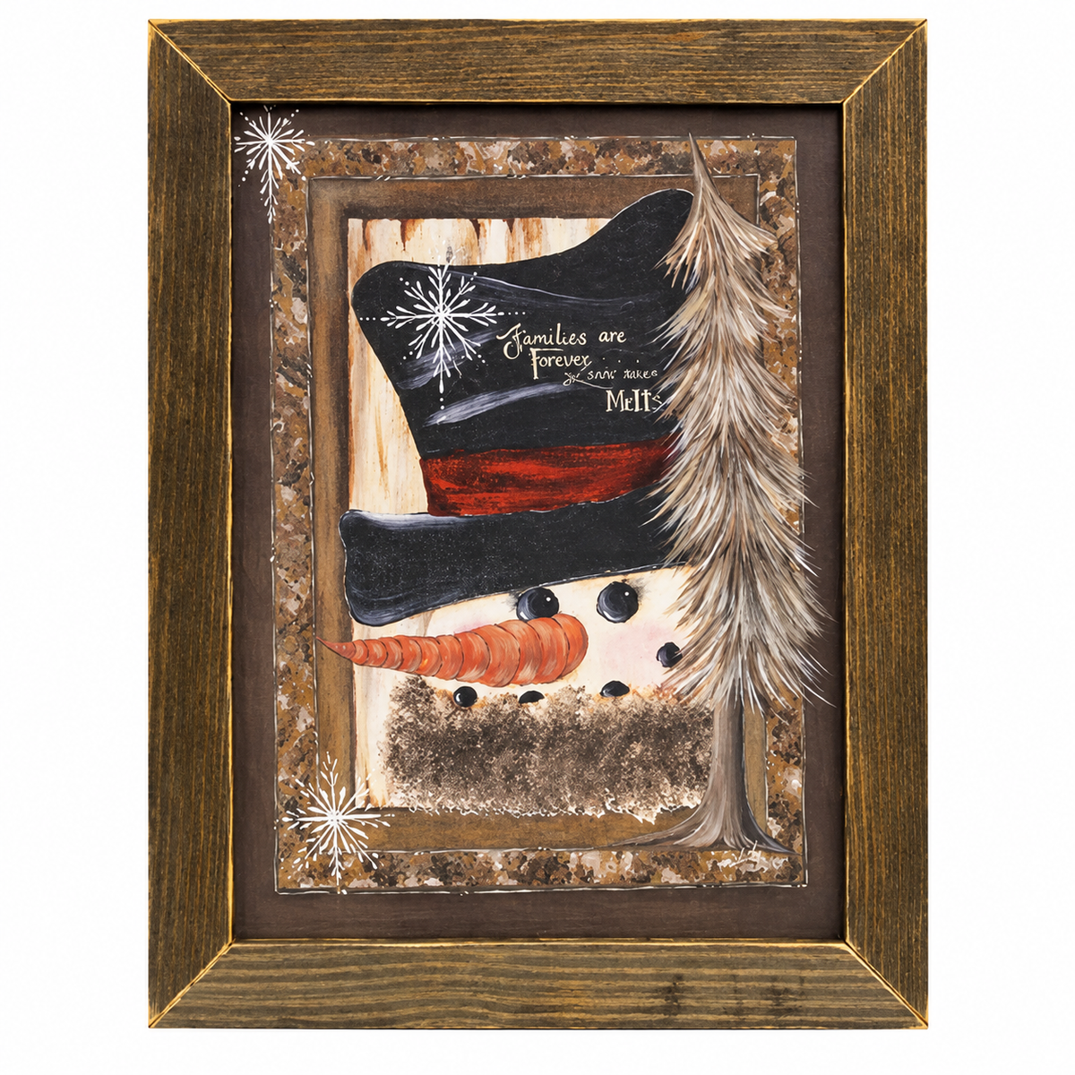 Rustic farmhouse snowman wall art featuring a cheerful snowman with an orange carrot nose, black coal smile, and oversized black top hat with a deep red band. White snowflakes and a slender, snow-covered evergreen tree accent the vintage-inspired winter scene. A distressed dark brown wooden frame with warm golden highlights surrounds the artwork, displayed against a clean white background.