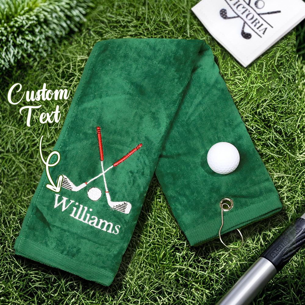  green golf towel with the customer's personalized embroidered last name, featuring a sturdy clip for easy attachment to golf bags or backpacks.