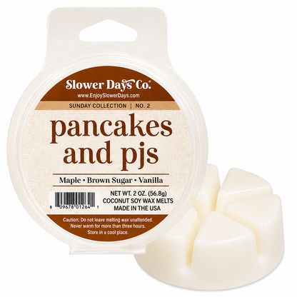 Slower Days Co. 'Pancakes and PJs' coconut soy wax melts in a clear round plastic tub with a hanger tab, shown next to three cubed off-white wax melts on a white background.