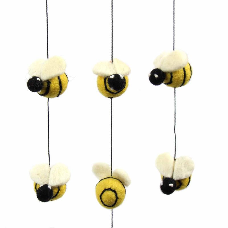 Ethically made Fair Trade wool hanging mobile, featuring a beehive and tiny felt bees.