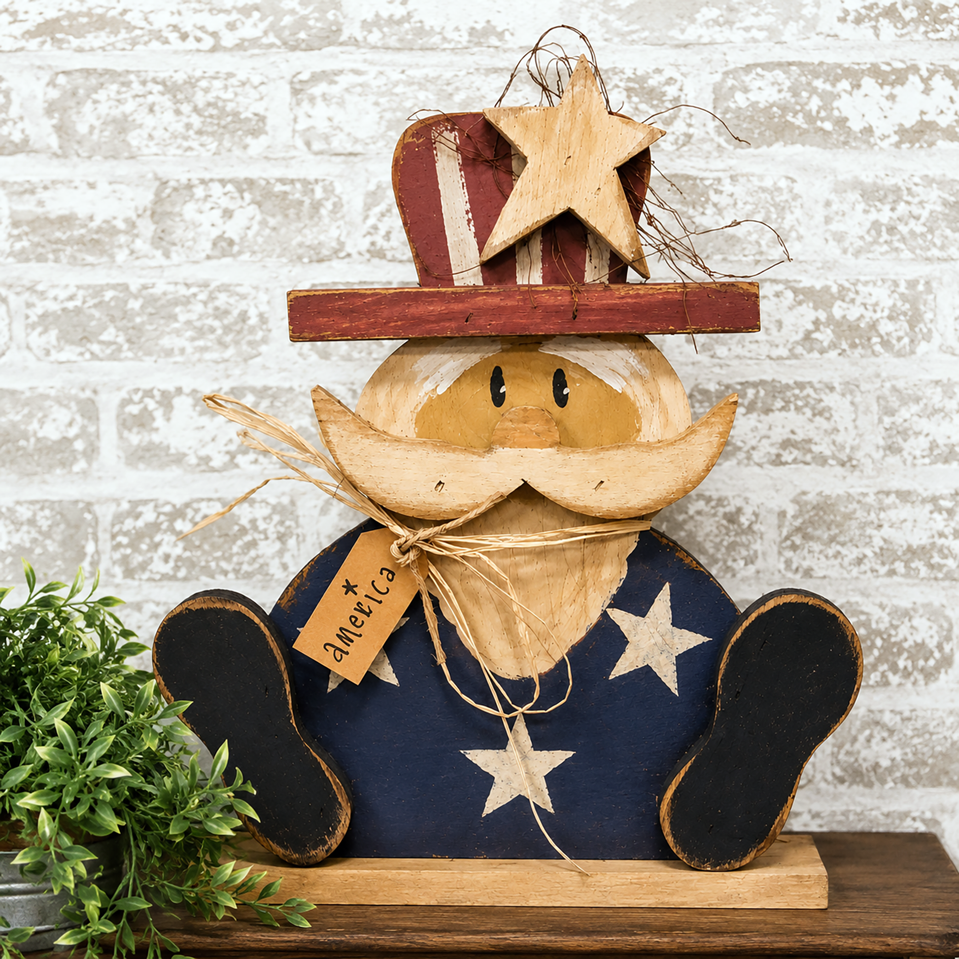 Rustic wooden Uncle Sam sitter with distressed patriotic finish and primitive Americana farmhouse decor styling