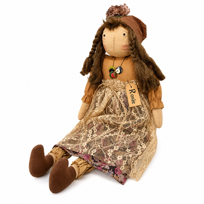 Decorative primitive rag doll with layered floral clothing, vintage-style button necklace, braided hair, paper Rosie name tag, and homespun country farmhouse styling for shelves, baskets, and seasonal displays.