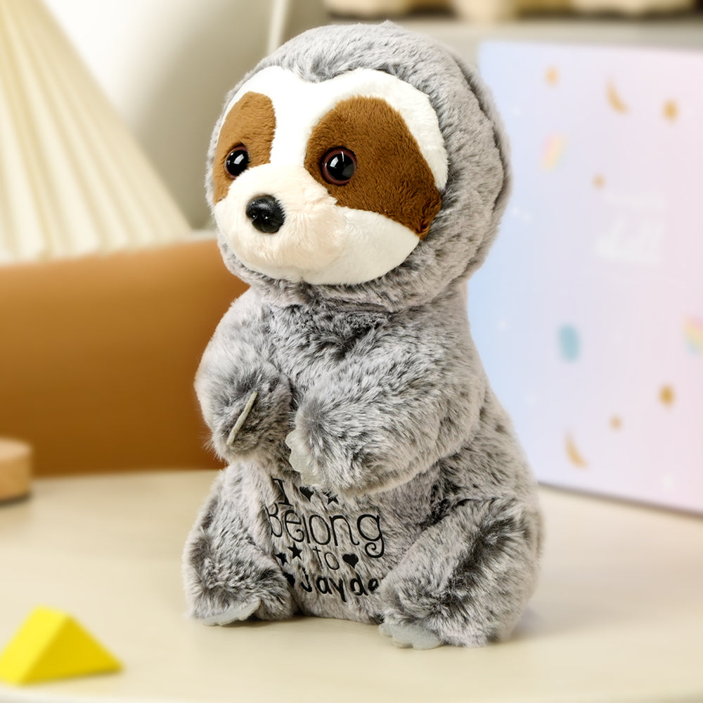 A close-up side view of the personalized sloth plush toy, showcasing its soft design and the custom baby’s name, adding a personal touch to this cuddly companion.