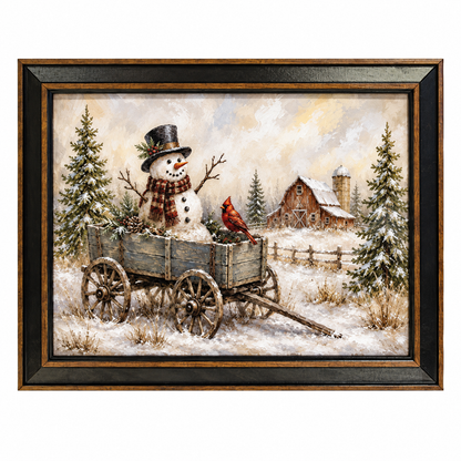 Framed winter landscape artwork showing a snowman in a wagon with a red cardinal, snow-covered trees, a rustic barn, and a cloudy sky, presented in a dark wood frame against a white background.